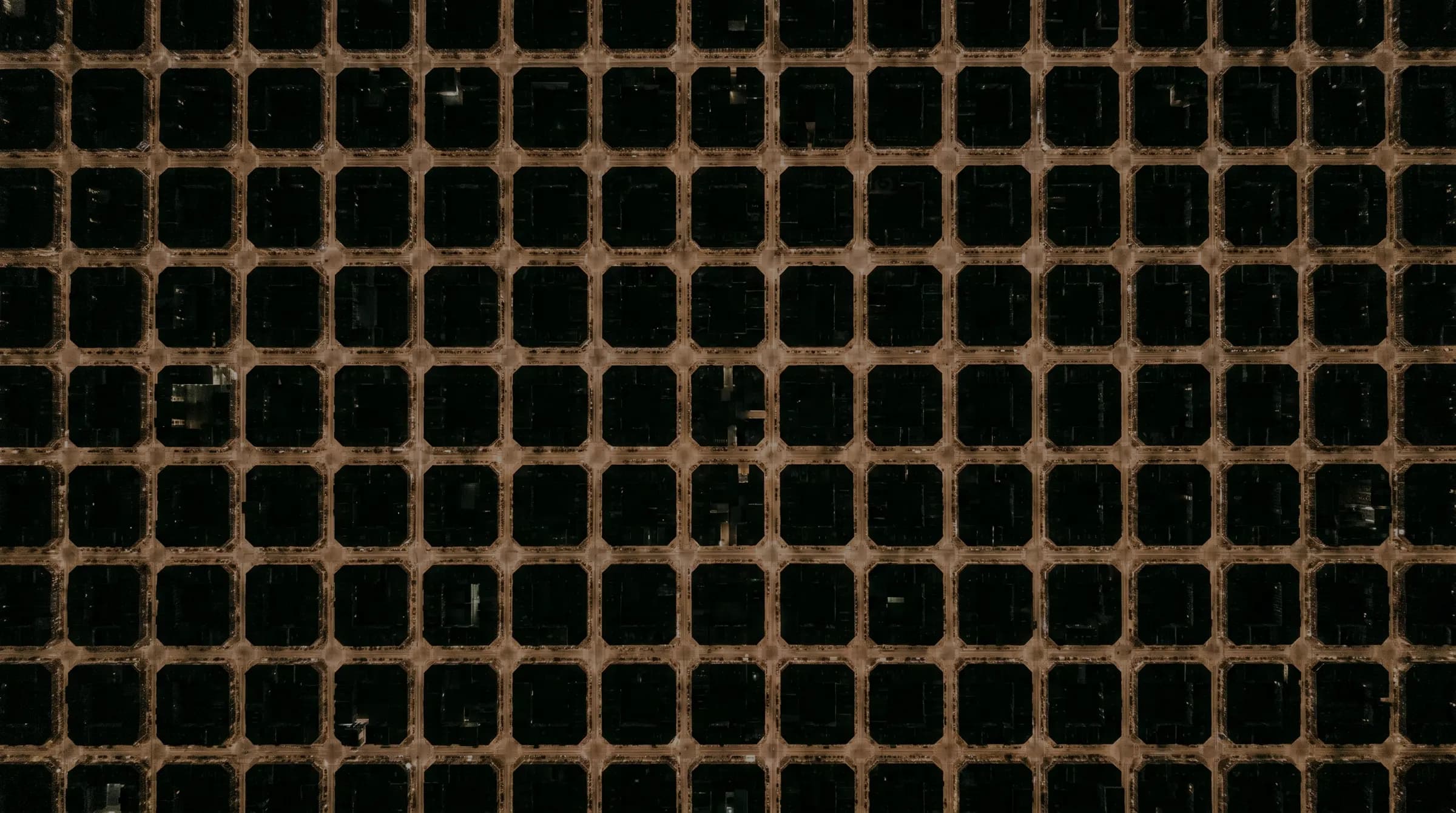 Night aerial photo of a city street grid with a heart-shaped route traced along the streets