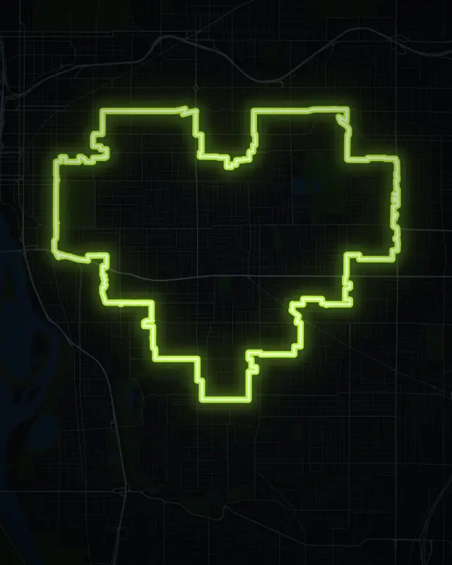 A pixel heart GPS art route in Southeast Portland, glowing green on a dark map